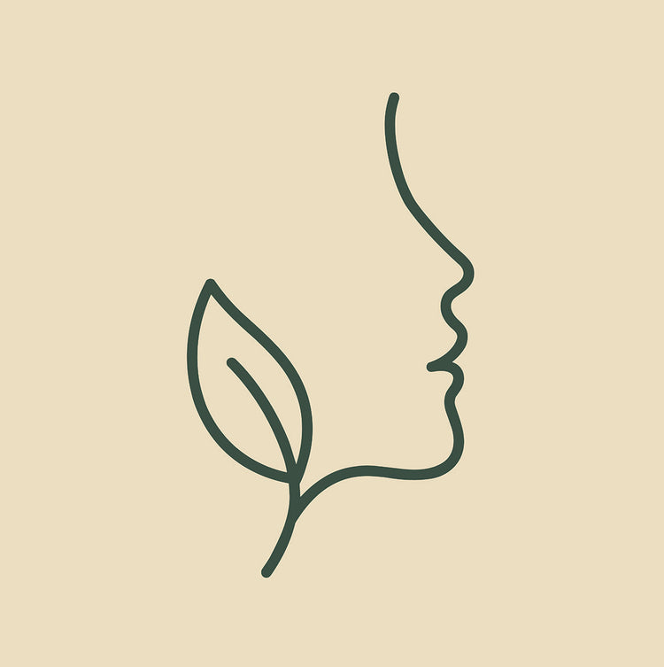 Icône représentant un visage et une feuille, symbolisant la beauté naturelle de la peau et des cheveux